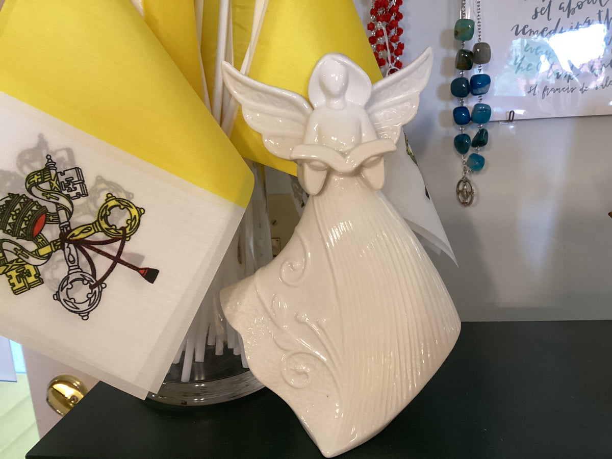 Angel with book figurine